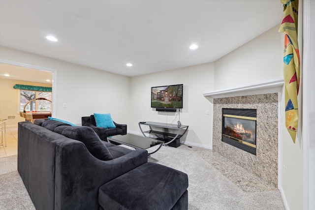 living room with light carpet and a high end fireplace