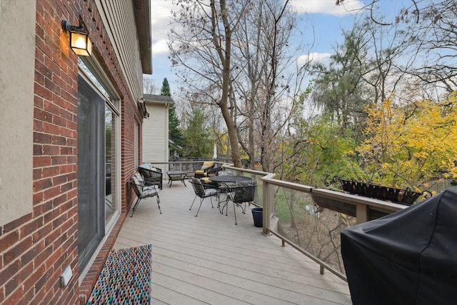 wooden deck featuring area for grilling