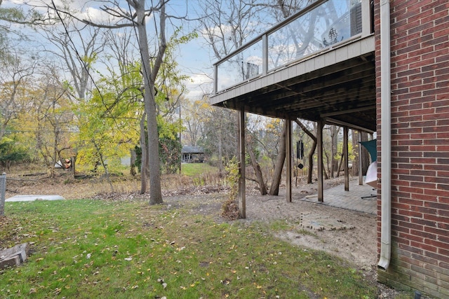 view of yard featuring a wooden deck