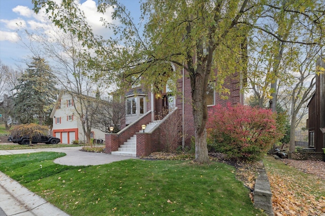 view of front of home with a garage and a front yard