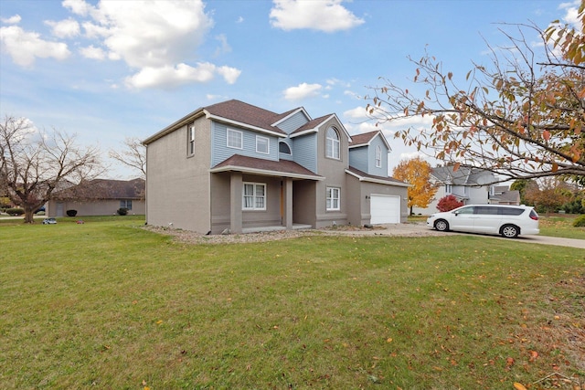 view of front of home featuring a front yard and a garage