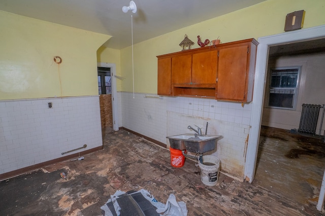 kitchen with tile walls and sink