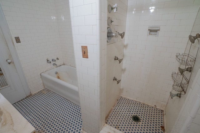 bathroom with tile patterned floors and plus walk in shower