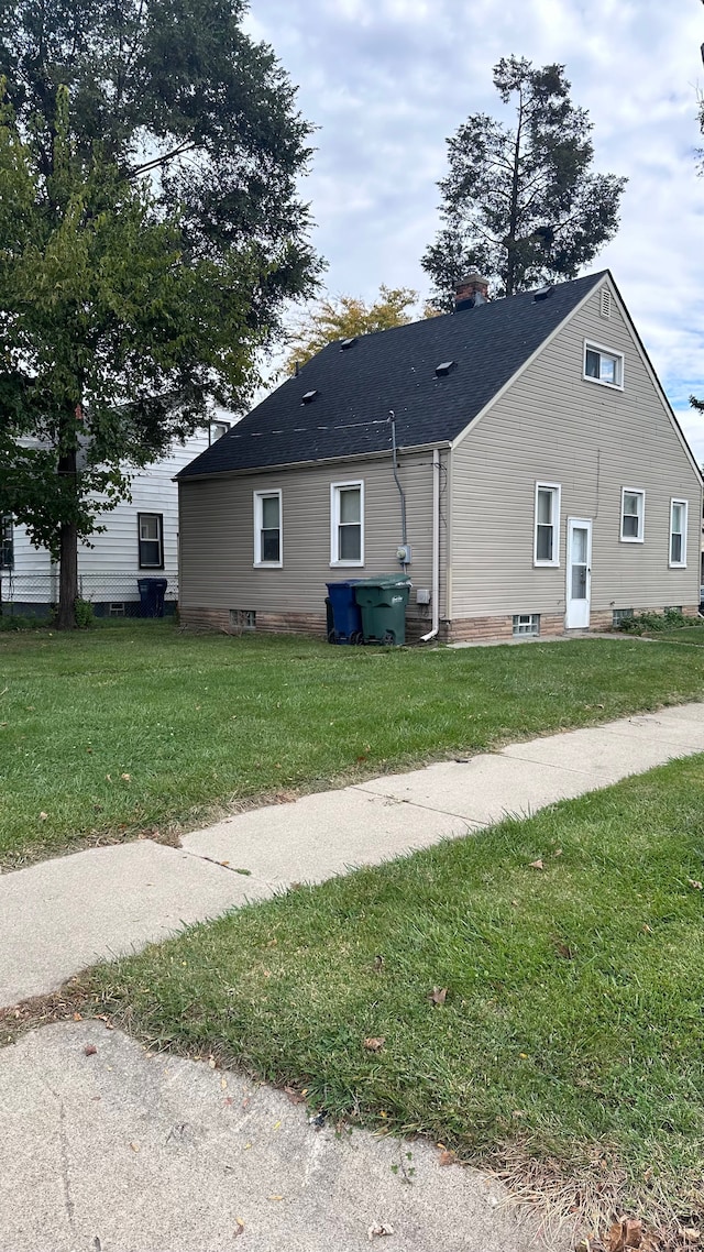 view of home's exterior featuring a yard