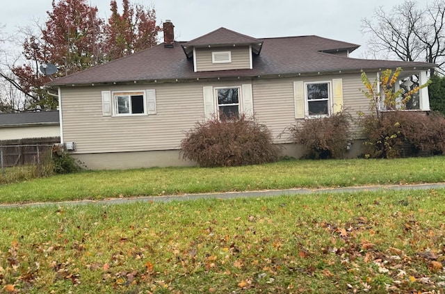 view of property exterior featuring a lawn