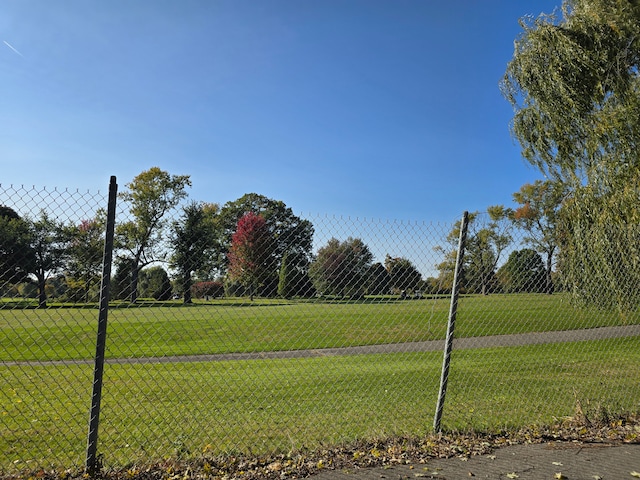 surrounding community featuring a yard