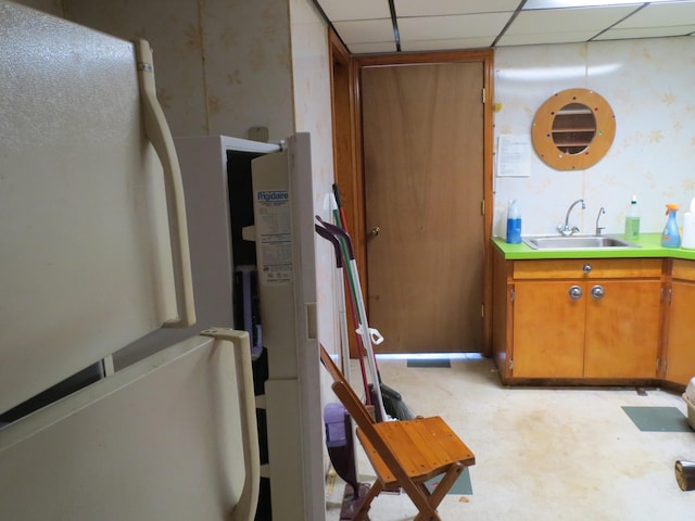 bathroom featuring vanity and a drop ceiling