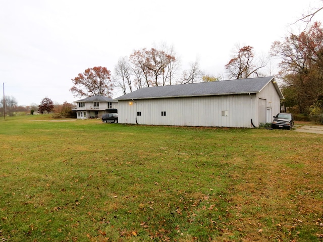 back of property featuring a yard