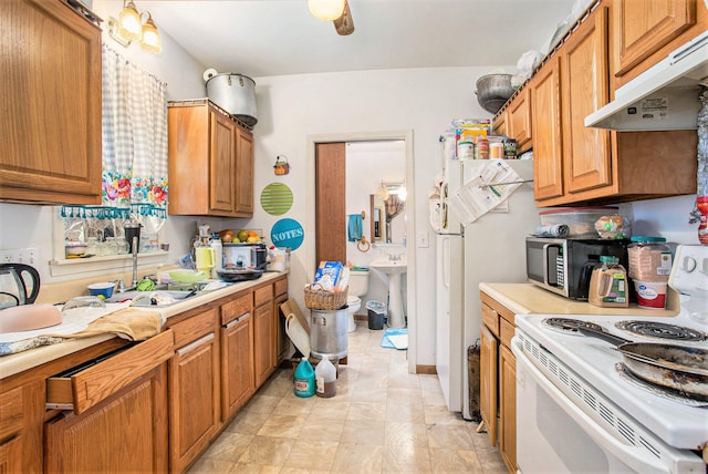 kitchen with white appliances and sink