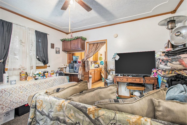 living room with ceiling fan, light colored carpet, a textured ceiling, and ornamental molding