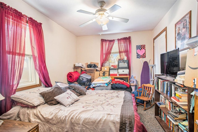 bedroom with ceiling fan and carpet floors