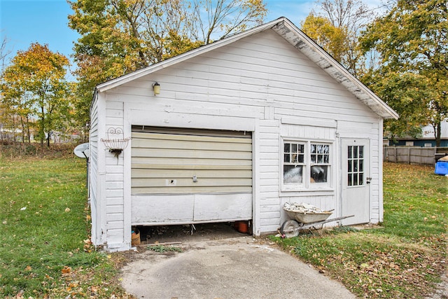 garage featuring a yard