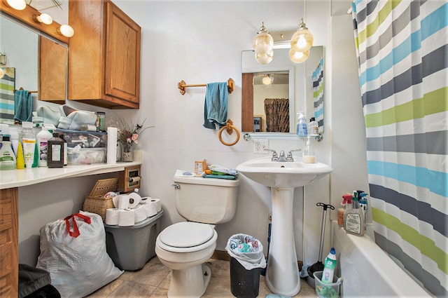 bathroom with tile patterned floors and toilet