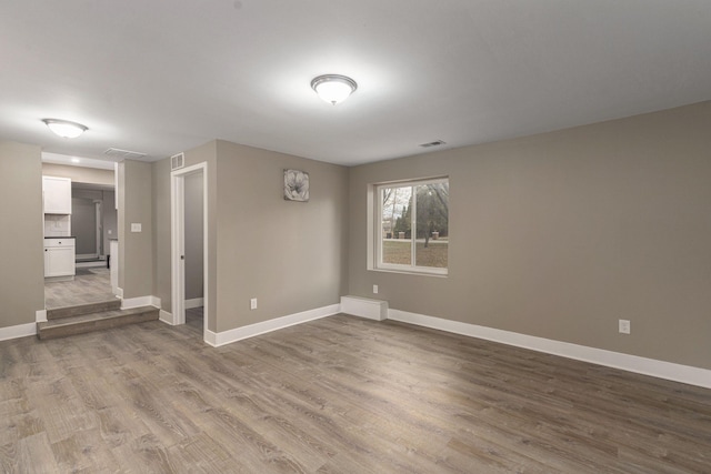 unfurnished room with light wood-type flooring