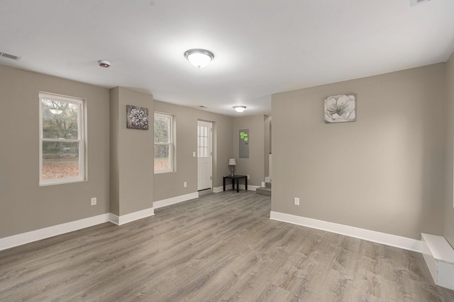 spare room featuring light wood-type flooring