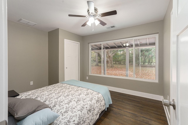 bedroom featuring ceiling fan and dark wood-type flooring