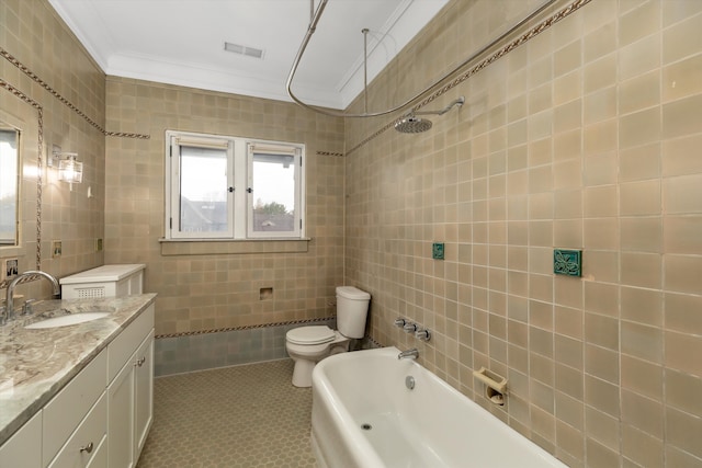 full bathroom featuring tile walls, toilet, vanity, shower / bathtub combination, and ornamental molding