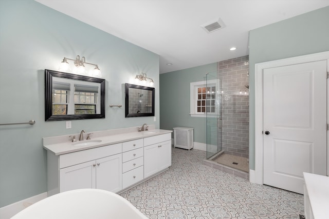 bathroom with tile patterned flooring, vanity, and independent shower and bath