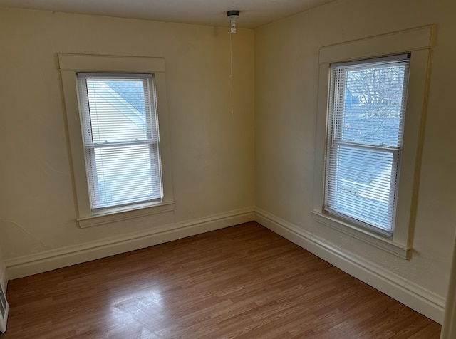 1707 E Stockbridge Ave, Kalamazoo, MI 49001 - spare room with baseboards and light wood-style floors