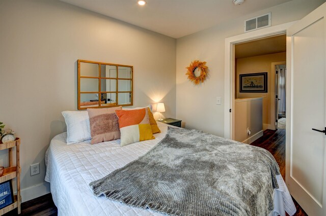 208 Gillis St, Traverse City, MI 49684 - bedroom with dark wood finished floors, recessed lighting, and baseboards