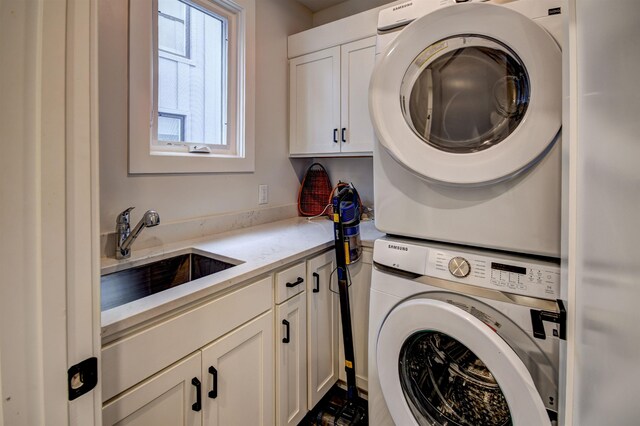 208 Gillis St, Traverse City, MI 49684 - washroom featuring estacked washer and dryer and cabinet space