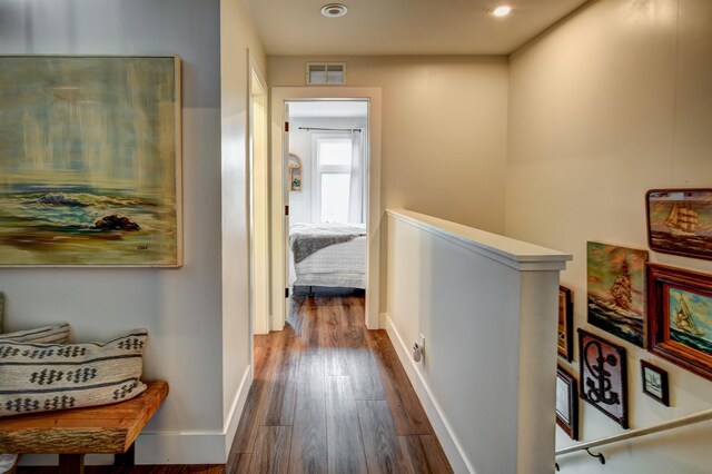 208 Gillis St, Traverse City, MI 49684 - hallway featuring an upstairs landing, dark wood-type flooring, baseboards, and recessed lighting