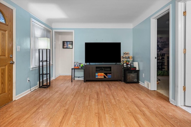 living room with light hardwood / wood-style floors