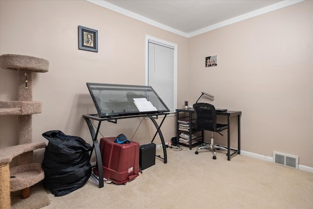 carpeted home office featuring crown molding