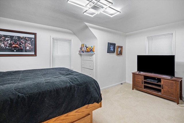 bedroom featuring light colored carpet