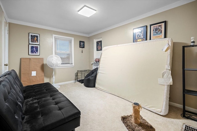 sitting room with carpet and ornamental molding