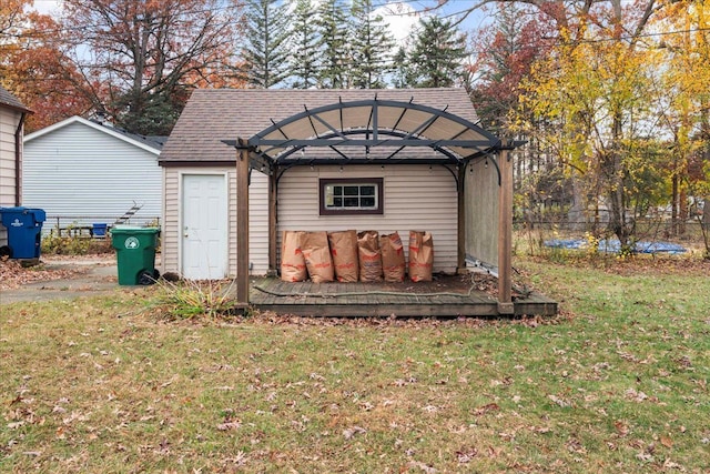 view of outbuilding featuring a lawn