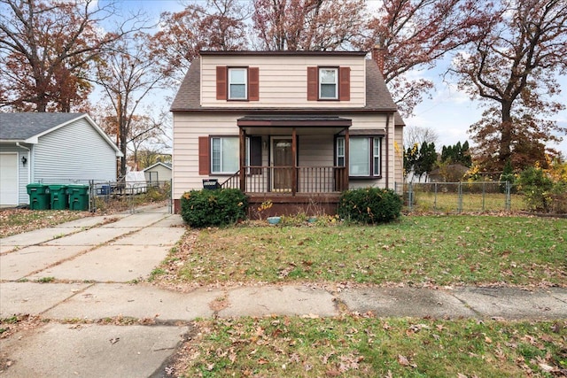 view of front of property featuring a porch and a front yard