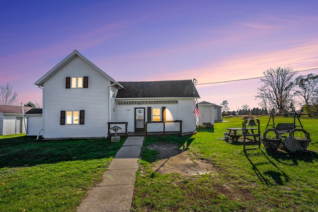 view of front of home with a lawn