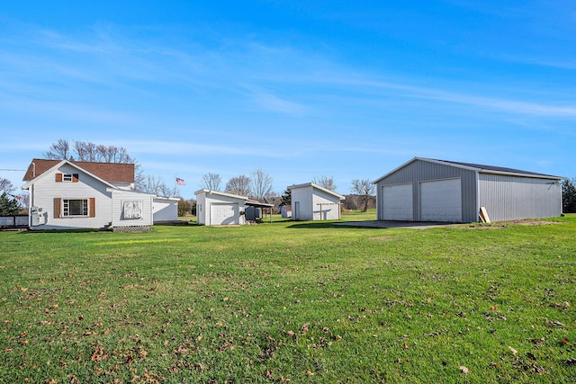 view of yard featuring an outbuilding and a garage