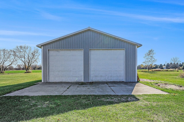 garage featuring a lawn