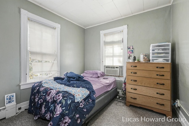 bedroom featuring carpet flooring, cooling unit, a baseboard radiator, and ornamental molding