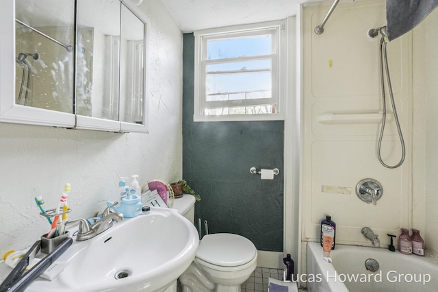 full bathroom featuring tile patterned flooring, toilet, shower / bathtub combination, and sink