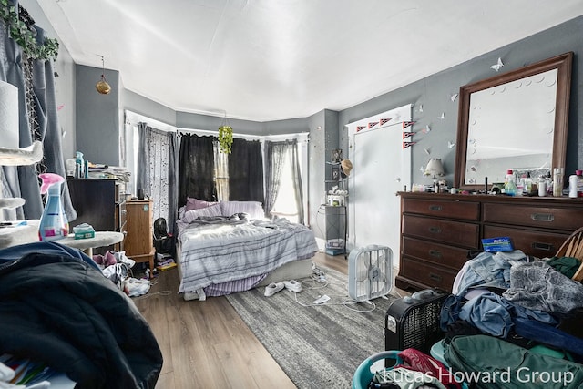 bedroom with light hardwood / wood-style floors