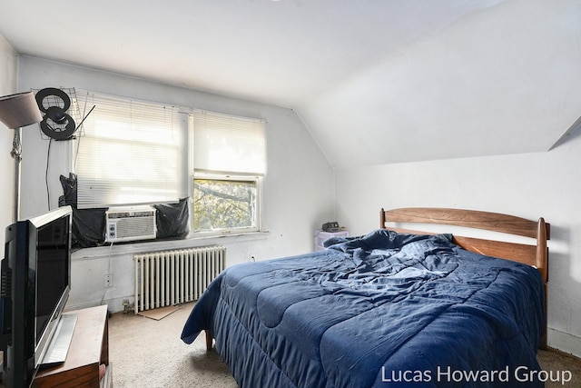 carpeted bedroom with cooling unit, radiator heating unit, and vaulted ceiling