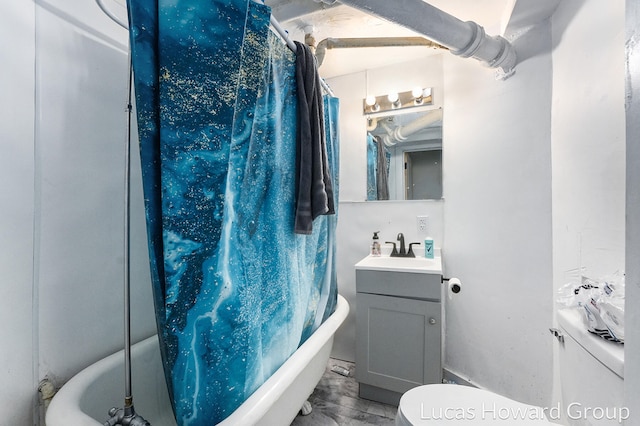 full bathroom with hardwood / wood-style floors, vanity, toilet, and shower / bath combo with shower curtain