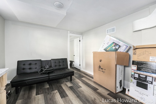 living room featuring dark wood-type flooring