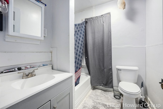 full bathroom featuring vanity, toilet, and shower / tub combo