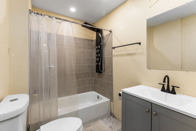 5393 Seebaldt St, Detroit, MI 48204 - full bathroom with toilet, a textured wall, vanity, and shower / tub combo