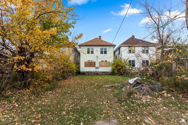 5393 Seebaldt St, Detroit, MI 48204 - rear view of house with a chimney and a lawn