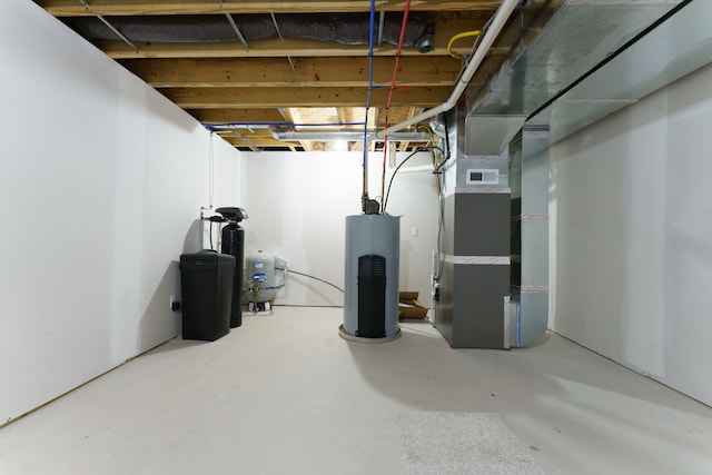 basement featuring heating unit and water heater