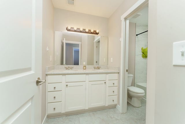 full bathroom featuring tile patterned floors, vanity, toilet, and tiled shower / bath