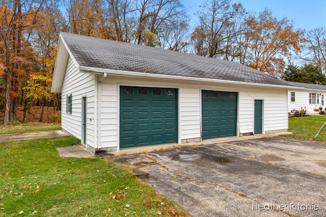 garage with a yard