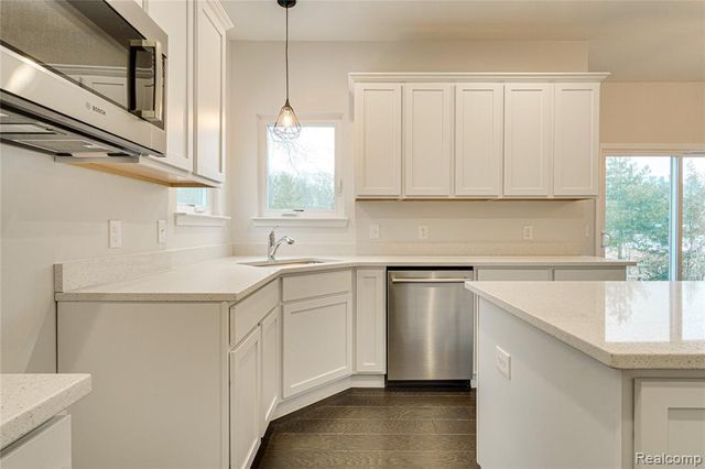 kitchen featuring white cabinetry, plenty of natural light, and appliances with stainless steel finishes