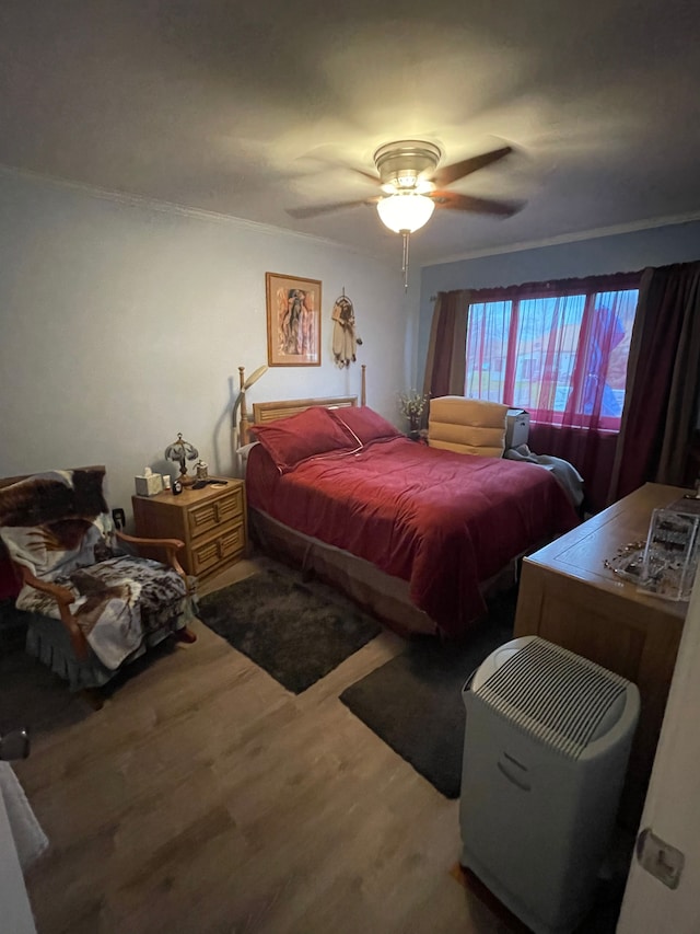 bedroom featuring ceiling fan and wood-type flooring