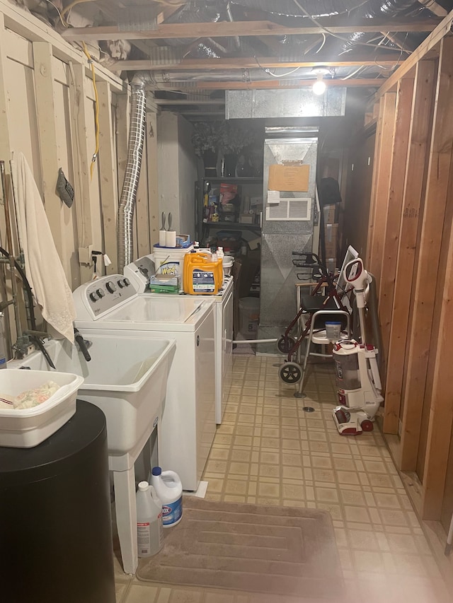 laundry area with separate washer and dryer and wooden walls